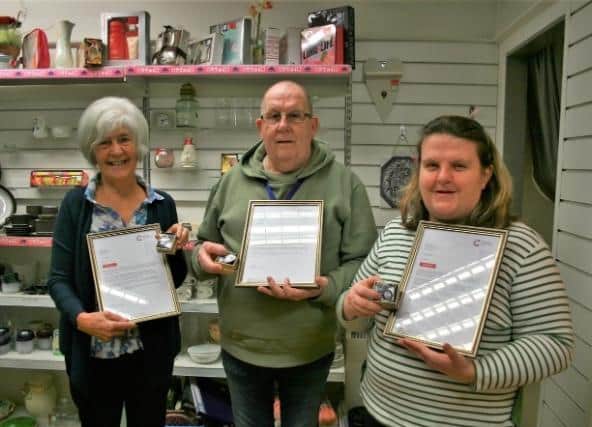 Cancer Research UK Derry City shop volunteers MsJoy Coskery and MrJim Kay with Jo.Mewett, Head of Retail Operations.