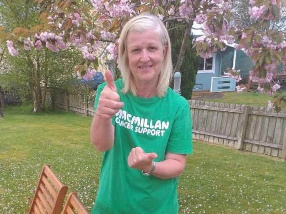 Macmillan Move More Programme participant Sandra Gallagher celebrates after completing a virtual climb of the steps of the Christ the Redeemer statue in Rio de Janeiro.