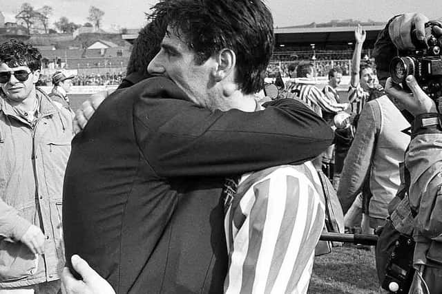 Felix embraces legendary treble winning manager, Jim McLaughlin after winning the title in 1989.