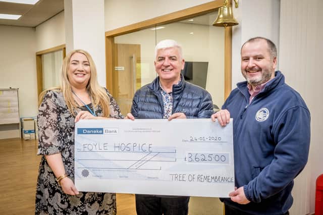 January 2020: John McMonagle, Tree of Remembrance , organised by Life Tree at Foyleside  presenting a cheque for £3,625 to Ailbhe Temple and Donal Henderson, Foyle Hospice, the proceed of collections during Christmas. Fundraising has been severely impacted since the pandemic restrictions have been introduced.  (Stephen Latimer Photography)