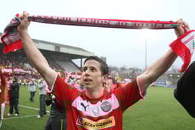 Cliftonville's Eamonn Seydak celebrates winning the Premiership in 2013.