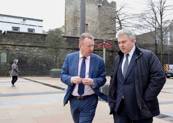 NI Secretary of State Brandon Lewis with Jim Roddy during his visit to Derry back in February. (Darren kidd/ PresEye)