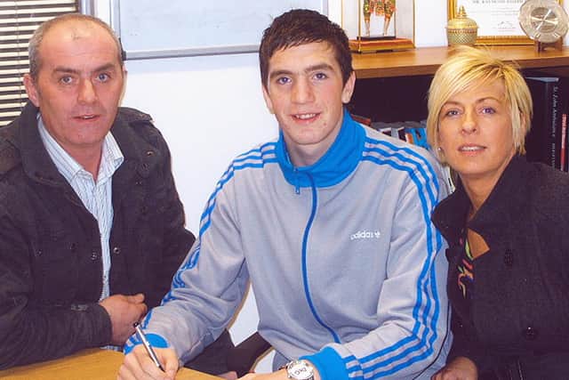 The late Brian Duffy pictured with his wife, Siobhin and son, Shane Duffy when signing a professional contract with Everton in 2009.