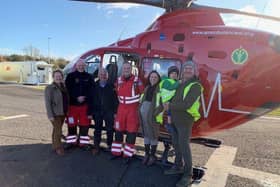 David Thompson, who was injured in a farm accident last year, pictured with and his family, HEMS paramedic Jason Rosborough and HEMS Doctor Russell McLaughlin.