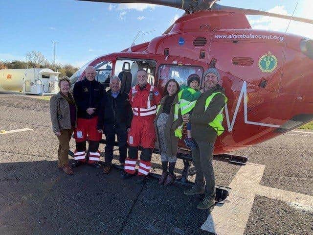 David Thompson, who was injured in a farm accident last year, pictured with and his family, HEMS paramedic Jason Rosborough and HEMS Doctor Russell McLaughlin.