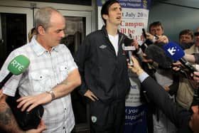 Ireland defender bid a final farewell to his father, Brian (left) at a funeral service in Derry this morning.