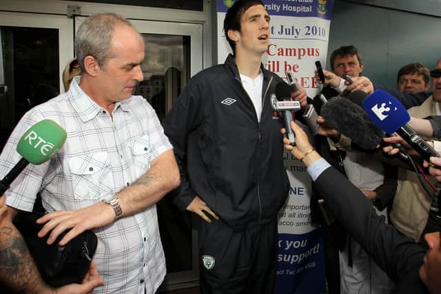 Ireland defender bid a final farewell to his father, Brian (left) at a funeral service in Derry this morning.