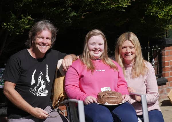 Tori with Steve and Dara after being presented with her birthday cake.