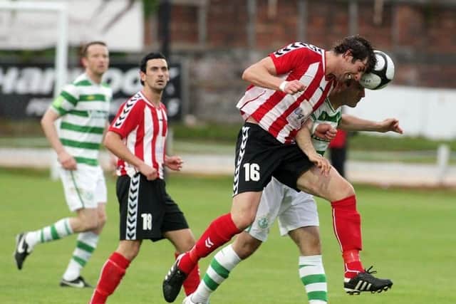 Vinny pictured in action for Derry City as his good friend, the late, Mark Farren watches on.