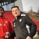 Defender, Danny Lupano pictured with Derry City boss, Declan Devine, has signed a contract extension with Hull City.