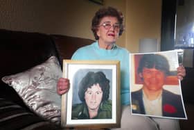 Bridie McBrearty, with pictures of her late sons George and Pat.
