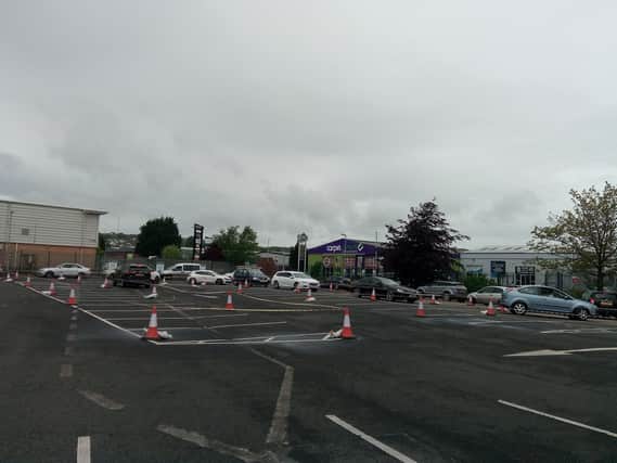 Cars queue at the Pennyburn recycling depot on Monday.
