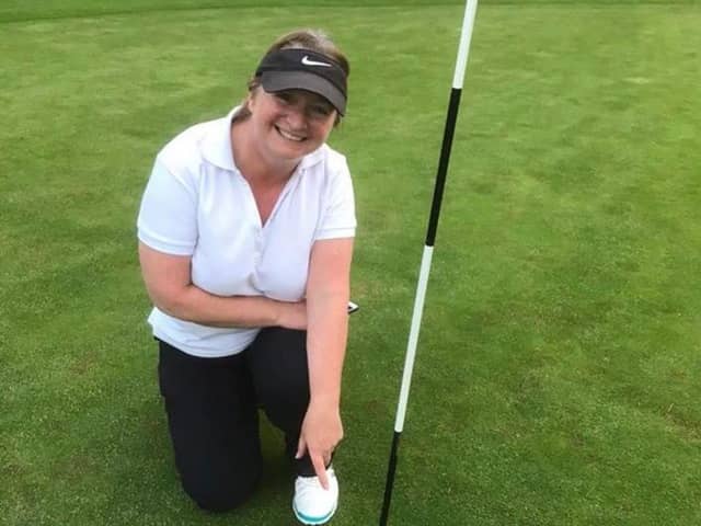 Jennie Flanagan points to her first ever 'hole in one' success, which she did at Prehen, on Wednesday.