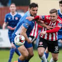 Mikhail Kennedy tussles with defender St Patrick's Athletic Gavin Peers during his loan spell with Derry City in 2017.