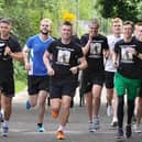 Rhys McDermott (far left) running the final few miles with some of his friends who took part in the challenge.