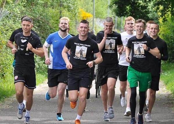 Rhys McDermott (far left) running the final few miles with some of his friends who took part in the challenge.