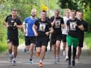 Rhys McDermott (far left) running the final few miles with some of his friends who took part in the challenge.