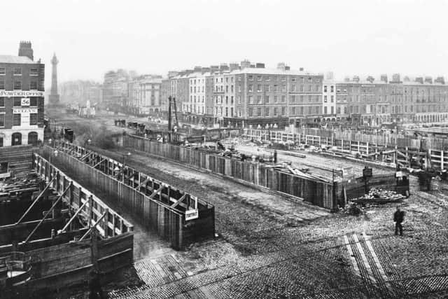 1879... Construction work on the new bridge seen from Aston Quay.