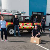 Alison Wallace from Waterside Neighbourhood Partnership pictured with members of Foyle Search and Rescue outside the main Waterside food distribution hub in Irish Street.