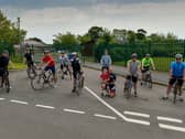 Pictured ahead of the start of their 90 day 16,000km bike challenge in aid of Ardnashee School and College is Martin McNutt with his son, Luca (8) (kneeling centre) and, from left to right, Ryan Magee, James McMonagle, Simon Collins, John OConnell, Dee OHara, Gary Curran, David Walker, Mark Crossan and Darren Boyle.