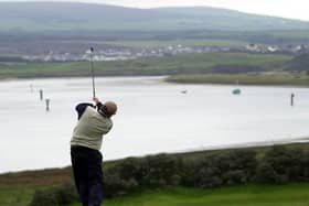 Driving off the scenic sixth tee at Portstewart Golf Club in Co Londonderry. Picture: Stephen Davison/Pacemaker Press