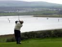 Driving off the scenic sixth tee at Portstewart Golf Club in Co Londonderry. Picture: Stephen Davison/Pacemaker Press