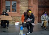 Lilian Seenoi- Barr, Director of Programmes at the The North West Migrants Forum taking a knee at the Justice for George Floyd rally held in Guildhall Square on Saturday afternoon last. DER2320GS – 035