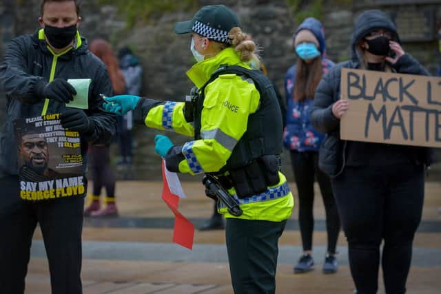 PSNI officers issued fines and community resolution notices during the Justice for George Floyd rally in Guildhall Square on Saturday afternoon last. DER2320GS -023