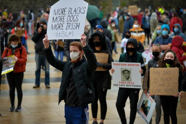 People carry posters at the Justice for George Floyd rally held in Guildhall Square on Saturday afternoon last. DER2320GS – 027