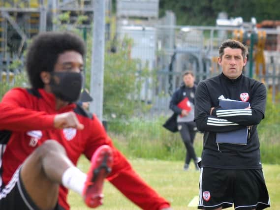 Derry City manager watches on as winger, Walter Figueira is put through his paces at Monday's training session at Aileach FC. Photo: Kevin Morrison