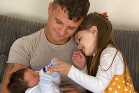 Derry middleweight boxer, Connor Coyle pictured with his daughter, Clodagh Rose and his new born son, Calaeb.
