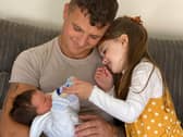 Derry middleweight boxer, Connor Coyle pictured with his daughter, Clodagh Rose and his new born son, Calaeb.