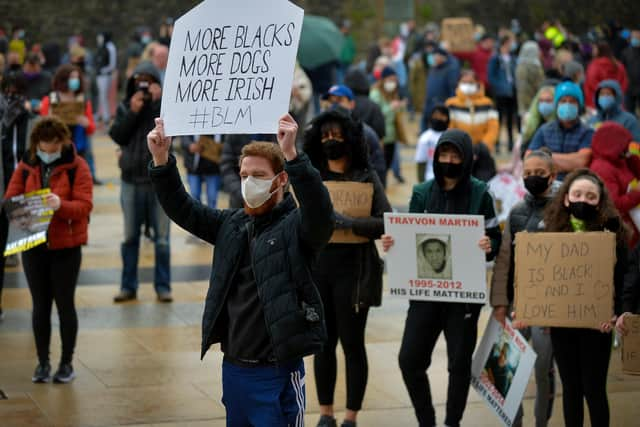 People carry posters at the Justice for George Floyd rally held in Guildhall Square on Saturday afternoon last. DER2320GS – 027