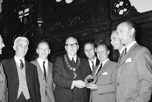 Mayor of Derry, Cllr, Albert Anderson presents FK Lyn officials with the citys coat of arms during their visit in 1965. Pictured from left is Derry City director, George Colgan, FK Lyn manager, Thor Hernes (coach), Per Torgersen, Martin Olsen, Einar Dhlen and Odd Chr. Hauge