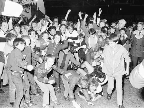 Dungiven players and supporters celebrate their 1983 Derry senior Championship victory over Magherafelt.