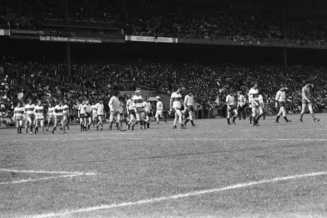 The Derry and Dublin players make their way around the pitch in the pre-match parade before the 1975 All Ireland semi-final.