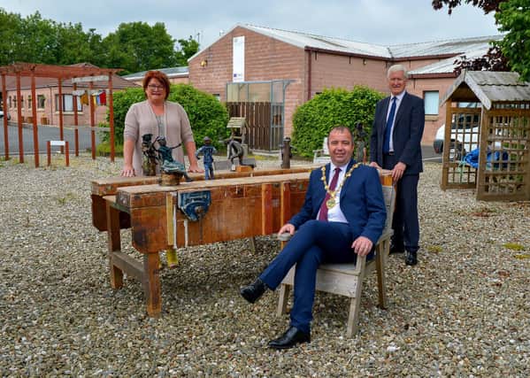 The Mayor of Derry and Strabane Colr. Brian Tierney pictured with Pauline Flangan, Service Manager Action Mental Health New Horizons and David Babington, CEO, during a visit to the charity’s facility in Springtown Industrial Estate. DER2025GS - 053