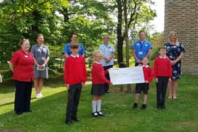 Pictured presenting the cheque front row are Lisnagelvin PS pupils Robbie and Ellie Lynch and Eli and Cilian Doherty along with their teacher Mrs Allison Buchan. Back row are Trauma & Orthopaedic Unit staff Mary Lafferty, Acting Nursing Services Manager; Rosin Kelly, Elective Orthopaedic Unit Manager; Sinead McDermott, Staff Nurse; Daphne Cuthbert, Health Care Assistant and Darren Colhoun, Health Care Assistant