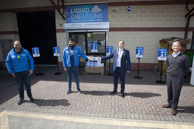 The Mayor of Derry City and Strabane District Council, Brian Tierney pictured on a visit to Liquid Creations at Newbuildings on Wednesday afternoon last where he received various hand sanitizers for the Councilâ€TMs Environmental Directorate, courtesy of Ankush and Moheet Vij, directors, Liquid Creations. On right is Alderman Maurice Devenney. (Photo: Jim McCafferty Photography)