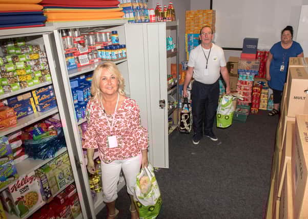 Shantallow Residents Association and a host of other organisations in the area have come together to form the Ballyarnett Community Response team recently. Pictured are Ciara Ferguson, Martin Connollly and Lorraine McWilliams who work in the Ballyarnett Community food distribution team. Picture Martin McKeowm 0720