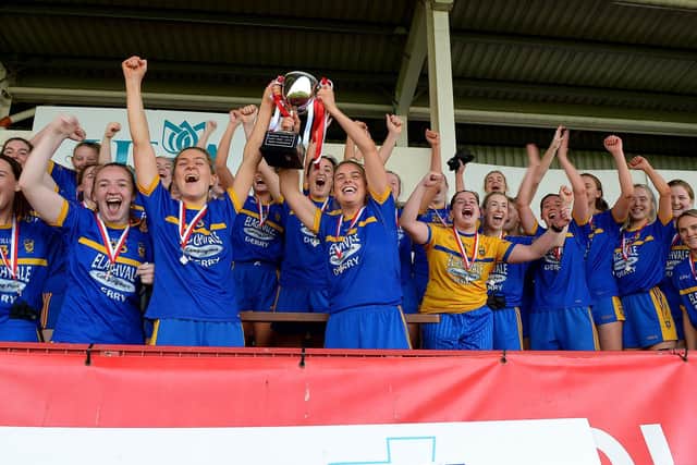 Steelstown joint captains Ciara McGurk and Aoife McGough lift the 2021 Errigal Senior Championship trophy in Celtic Park. (Photo: George Sweeney)
