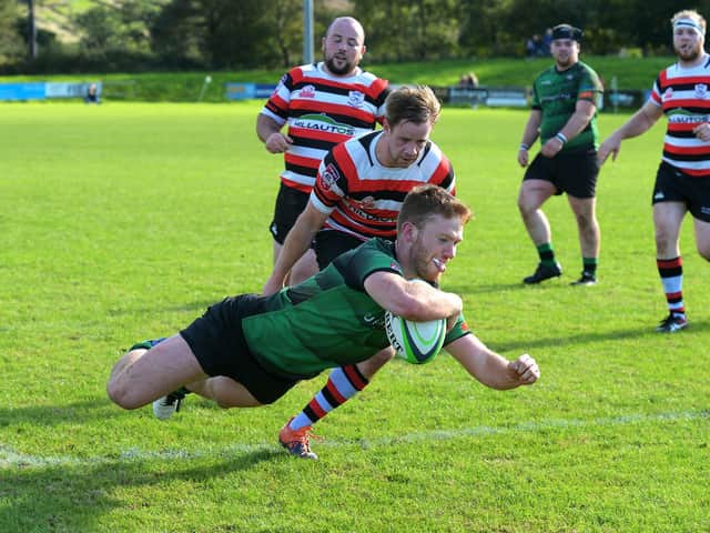Callum O'Hagan dives over the white wash to score a first half try for City of Derry. (Photo: George Sweeney)