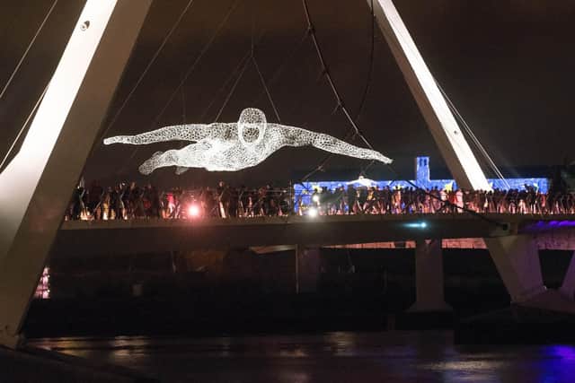 2013: One of The Travellers by Cedric Le Borgne suspended over the River Foyle which was part of the four day Lumiere Festival of light in produced by Artichoke as part of the City of Culture celebrations. Picture Martin McKeown. Inpresspics.com. 28.11.13