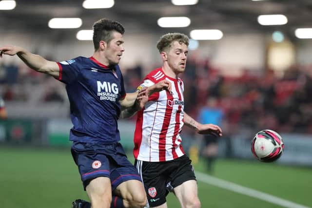 Derry City striker Jamie McGonigle gets in front of St Pat's defender Lee Desmond during Friday night's SSE Airtricity League clash at the Ryan McBride Brandywell. Photographs by Kevin Moore.