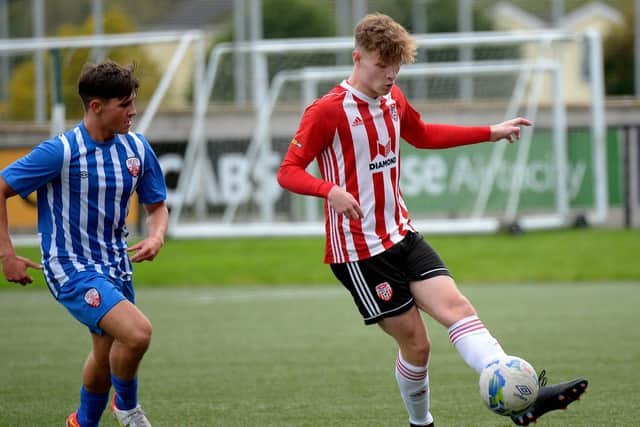 Derry City’s Mattie Walker holds off Treaty United’s Jonathan Morgan during Sunday's Enda McGuill Cup semi-final. Picture by George Sweeney.