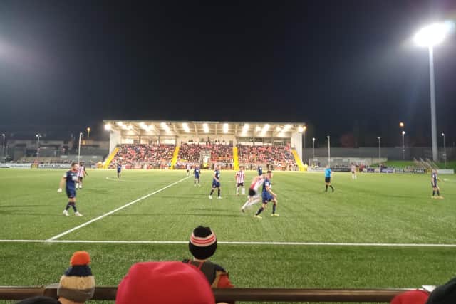 Fans watch the action as Derry take on St Pat's at the Ryan McBride Brandywell stadium on Friday night.