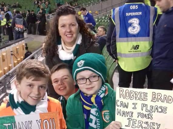 Liam with his two brothers and mother Diane at the Republic of Ireland vs Northern Ireland match a few years ago.
