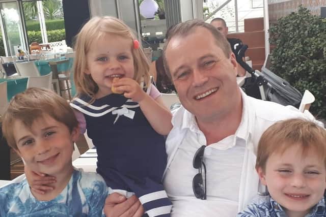 Andrew McGinley, with his children Conor, Carla and Darragh.