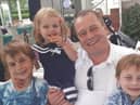 Andrew McGinley, with his children Conor, Carla and Darragh.