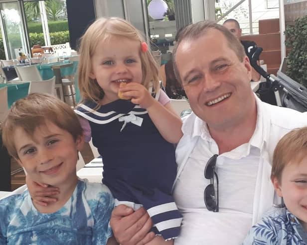Andrew McGinley, with his children Conor, Carla and Darragh.